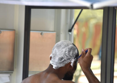 a man is shaving his head